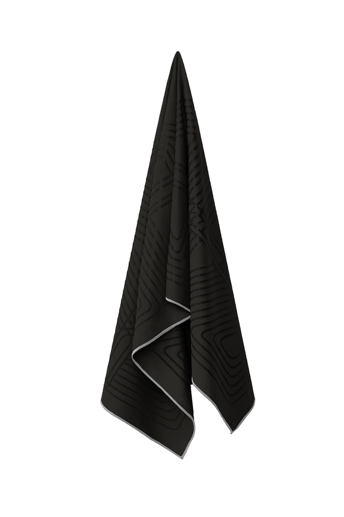 The GECKO WARRIOR – Nightfall yoga towel features a unique wet/dry grip Focus Alinement™ pattern made of tactile silicone, inspired by but not directly taken from ancient warrior cultures. It comes with a sleek black graphite base with contrasting colored stitching and is made using an eco-friendly, dye-free process.