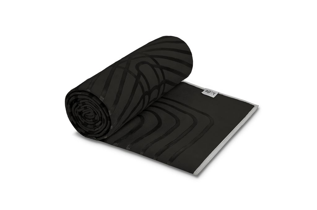The GECKO WARRIOR – Nightfall yoga towel features a unique wet/dry grip Focus Alinement™ pattern made of tactile silicone, inspired by but not directly taken from ancient warrior cultures. It comes with a sleek black graphite base with contrasting colored stitching and is made using an eco-friendly, dye-free process.