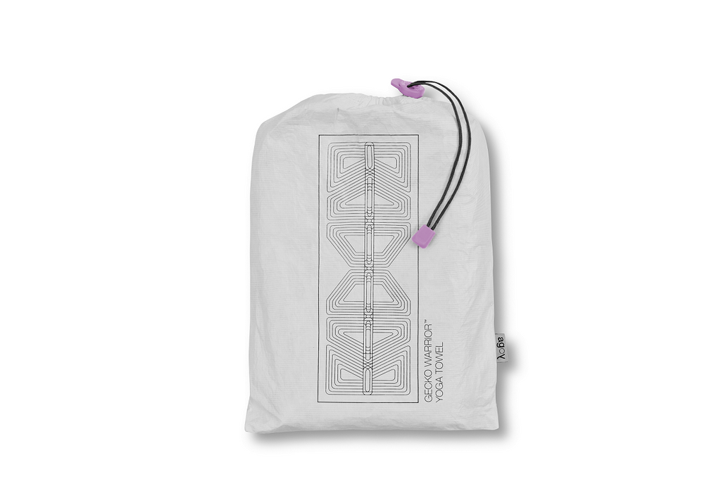 The GECKO WARRIOR – Nightfall yoga towel features a unique wet/dry grip Focus Alinement™ pattern made of tactile silicone, inspired by but not directly taken from ancient warrior cultures. It comes with a sleek black graphite base with contrasting colored stitching and is made using an eco-friendly, dye-free process.