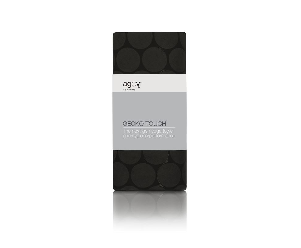 The GECKO TOUCH – Nightfall yoga towel features a simple yet elegant symmetrical circular pattern made of tactile silicone, offering a unique wet/dry grip. It comes with a sleek black graphite base with contrasting colored stitching and is made using an eco-friendly, dye-free process.