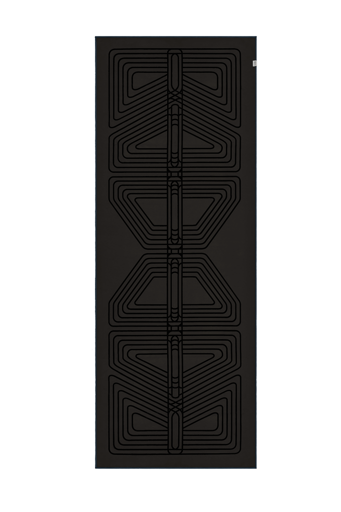 The GECKO WARRIOR – Nightfall yoga towel features a unique wet/dry grip Focus Alinement™ pattern made of tactile silicone, inspired by but not directly taken from ancient warrior cultures. It comes with a sleek black graphite base with contrasting colored stitching and is made using an eco-friendly, dye-free process.