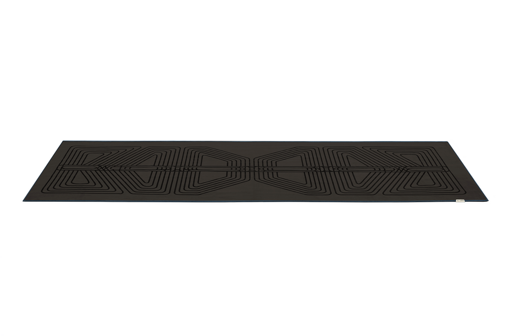 The GECKO WARRIOR – Nightfall yoga towel features a unique wet/dry grip Focus Alinement™ pattern made of tactile silicone, inspired by but not directly taken from ancient warrior cultures. It comes with a sleek black graphite base with contrasting colored stitching and is made using an eco-friendly, dye-free process.