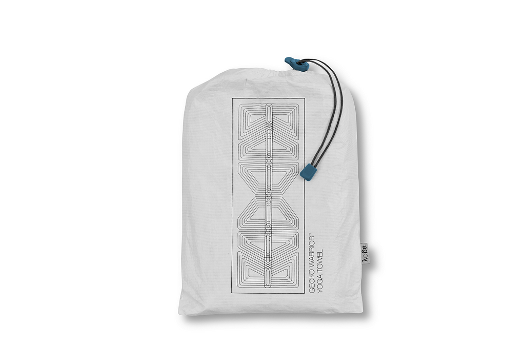 The GECKO WARRIOR – Nightfall yoga towel features a unique wet/dry grip Focus Alinement™ pattern made of tactile silicone, inspired by but not directly taken from ancient warrior cultures. It comes with a sleek black graphite base with contrasting colored stitching and is made using an eco-friendly, dye-free process.